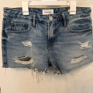 Frame Le grand garçon frayed denim shorts.